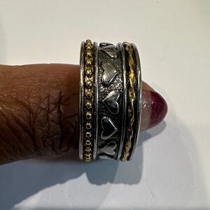 This is a Sundance Catalog Silver Gold “Heart To Heart Ring” Spinner